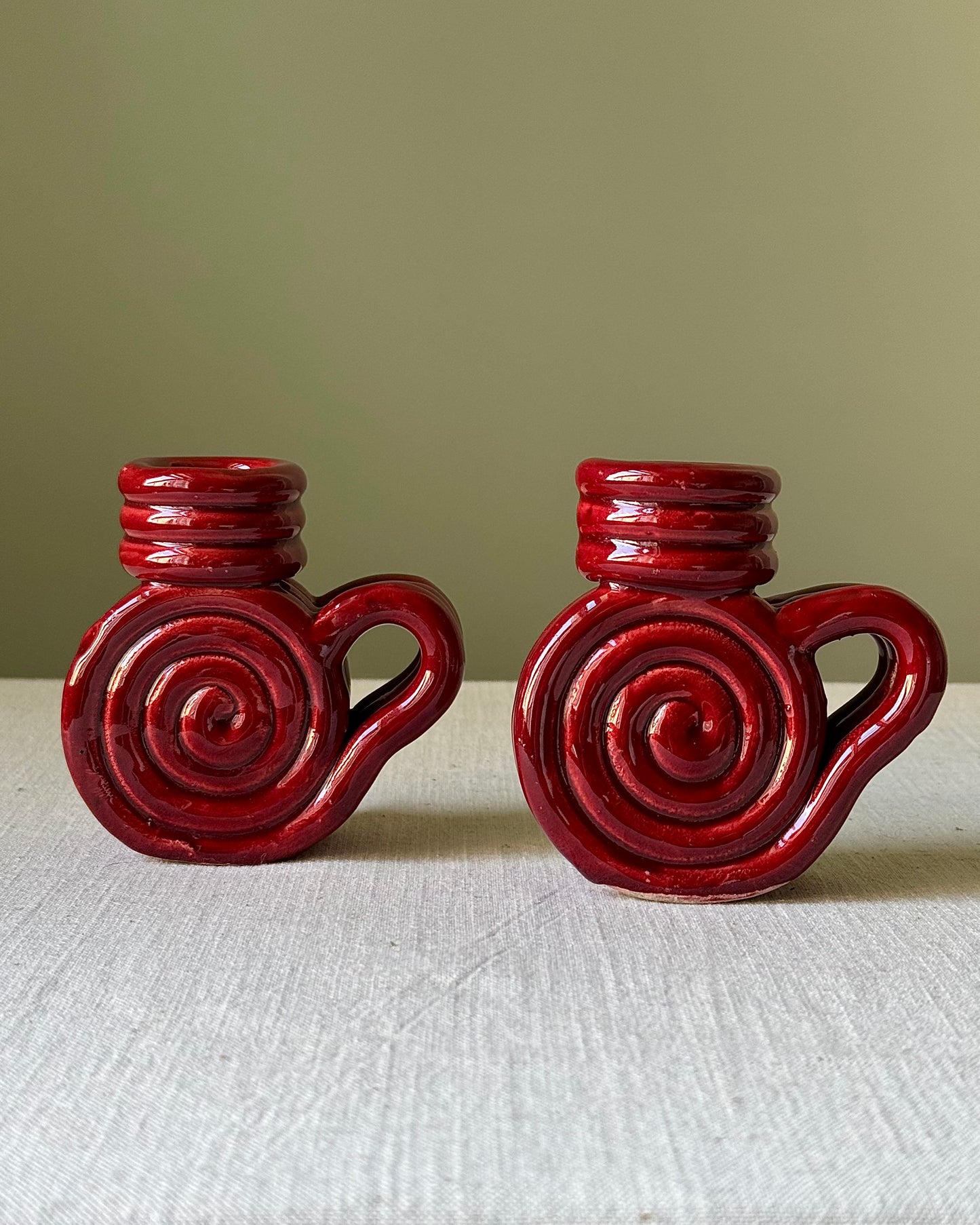 Pair of Vallauris Red Glaze Spiral Candlestick Holders
