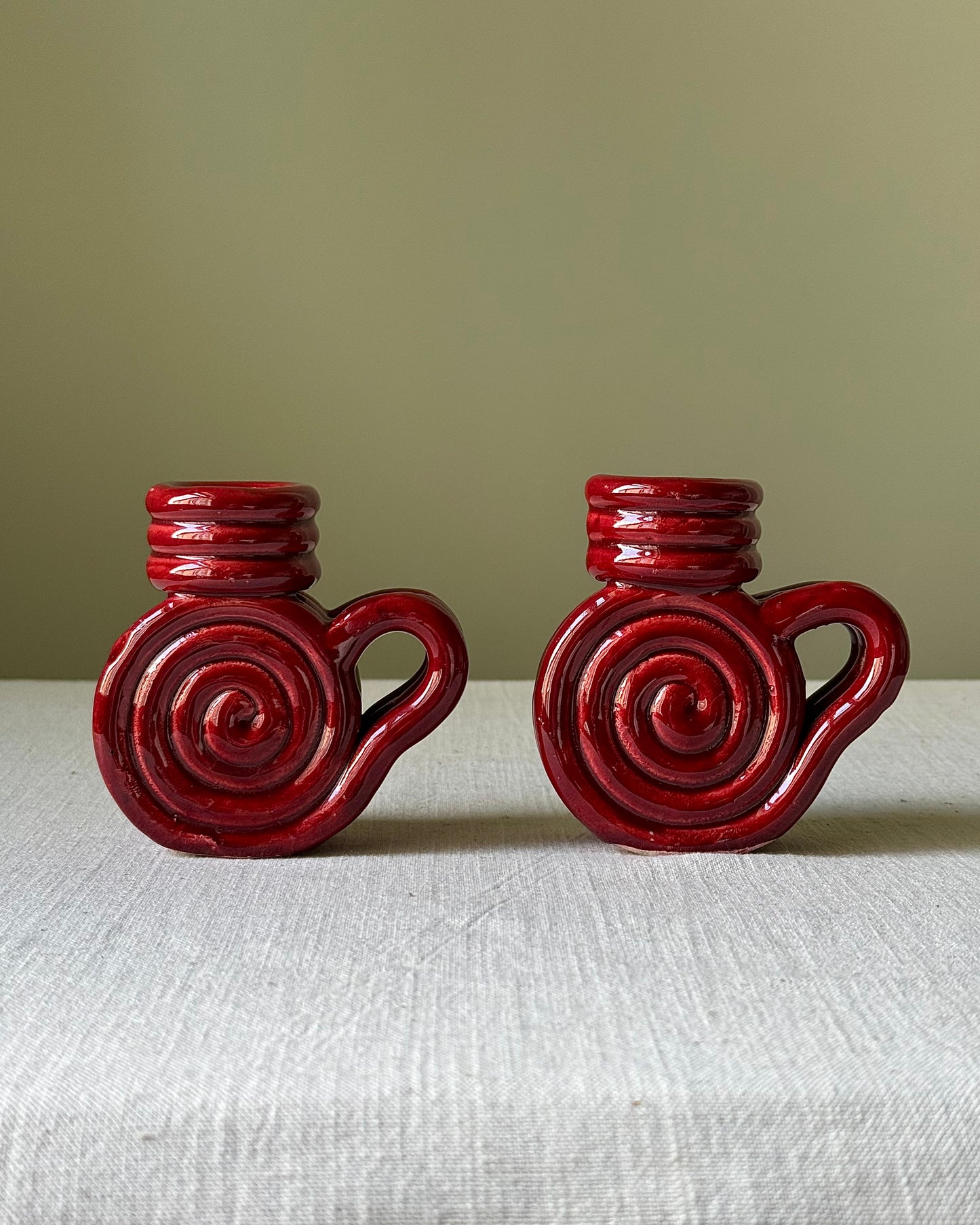 Pair of Vallauris Red Glaze Spiral Candlestick Holders