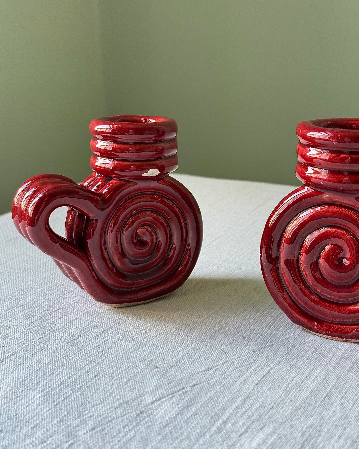Pair of Vallauris Red Glaze Spiral Candlestick Holders