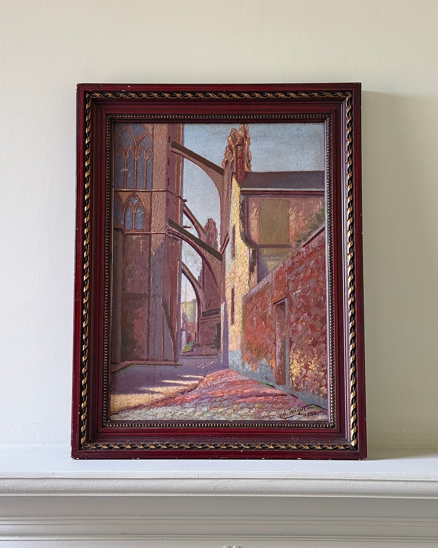 Mid century european architectural landscape oil on board depicting a cathedral in Chartres, France. The painting is in a post-impressionist style with influence from expressionism. The painting features a rich, somewhat muted colour palette with visible brush strokes, which adds an interesting texture. The painting is signed.