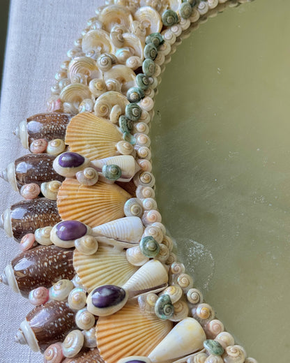 Profile view showing thicker lower border of vintage shell mirror