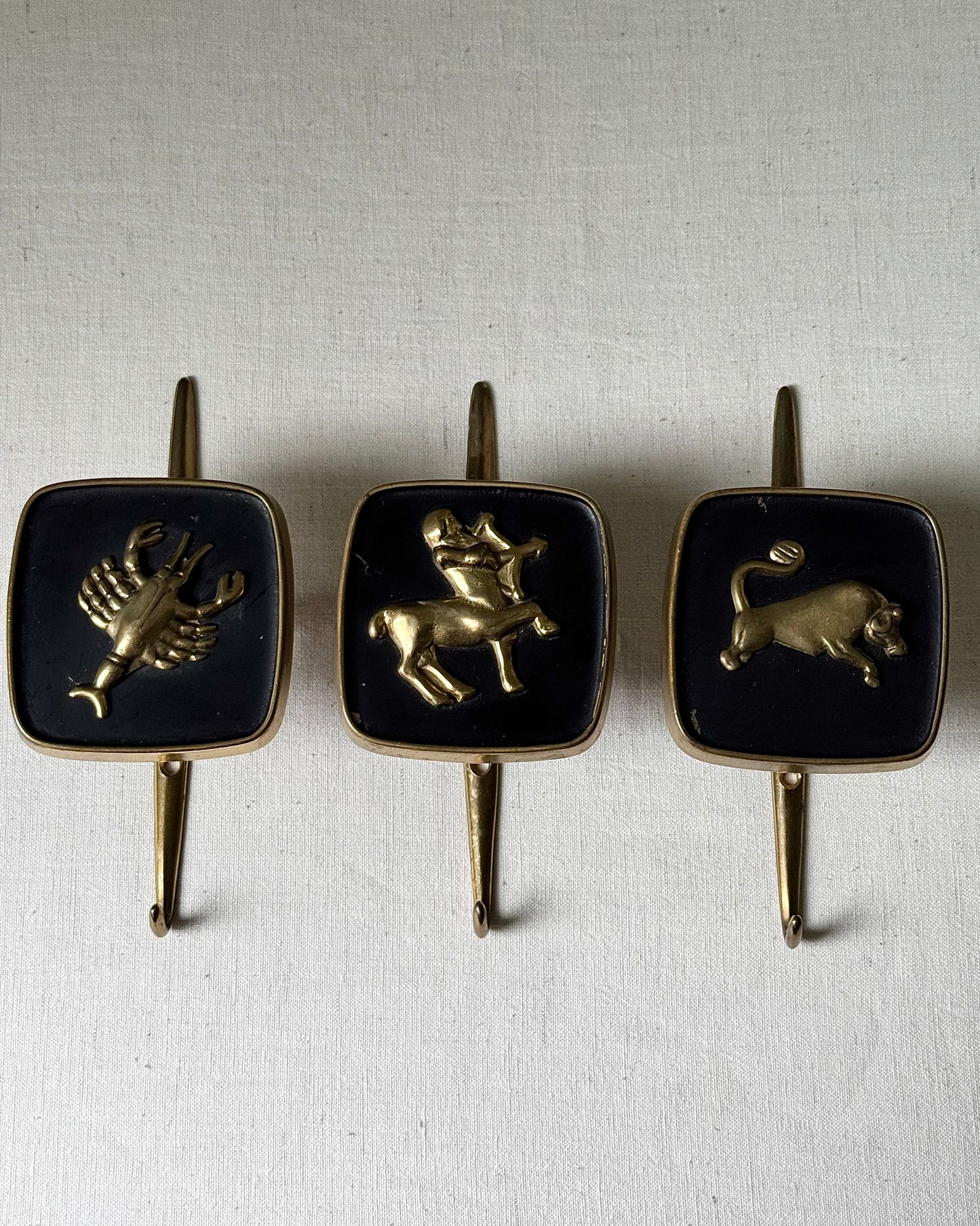 Brass Zodiac Hooks in the Style of Jacques Adnet, 1950’s