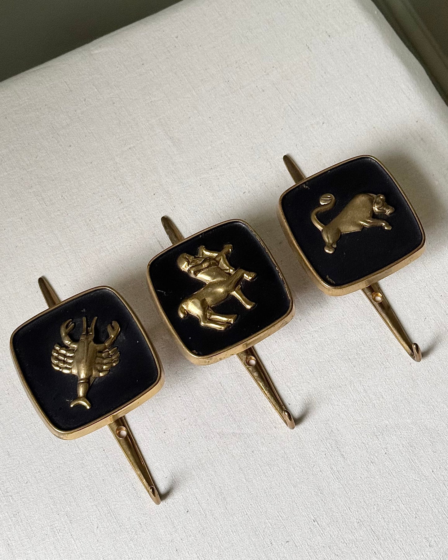 Brass Zodiac Hooks in the Style of Jacques Adnet, 1950’s